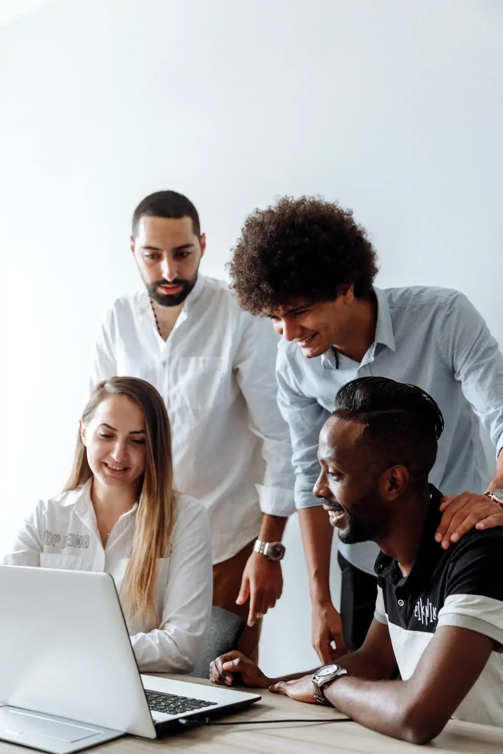 Diverse team working on laptop